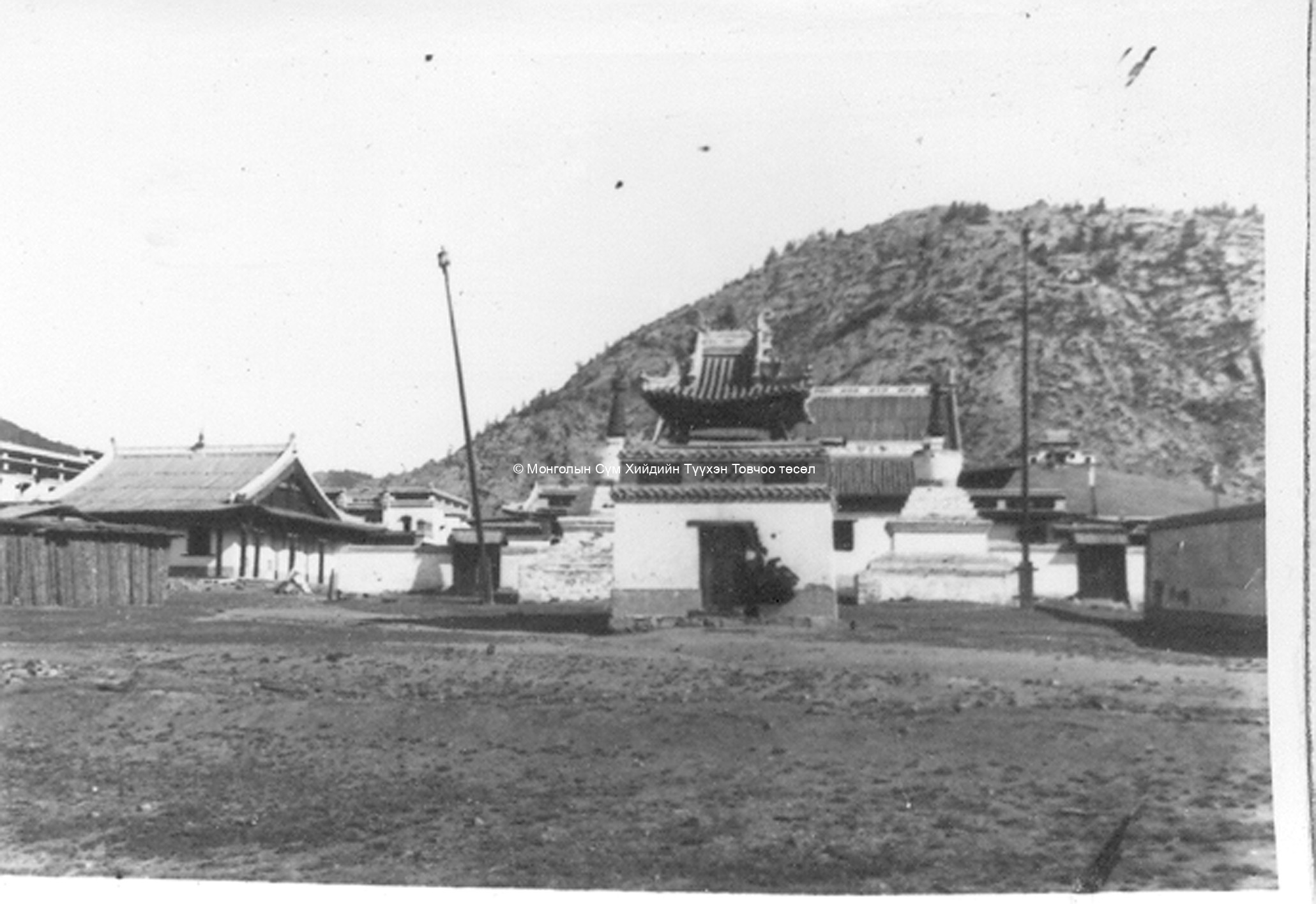 The main assembly hall with two stupas in the front, taken from the South. Film Archives ?